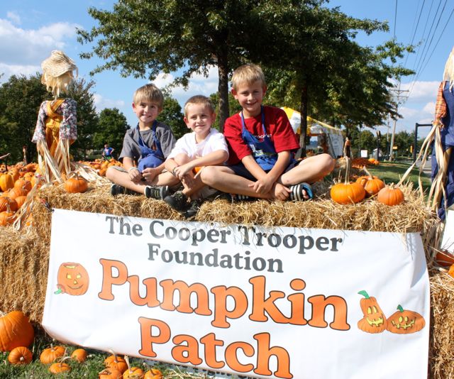 Boys with Pumpkin Patch sign